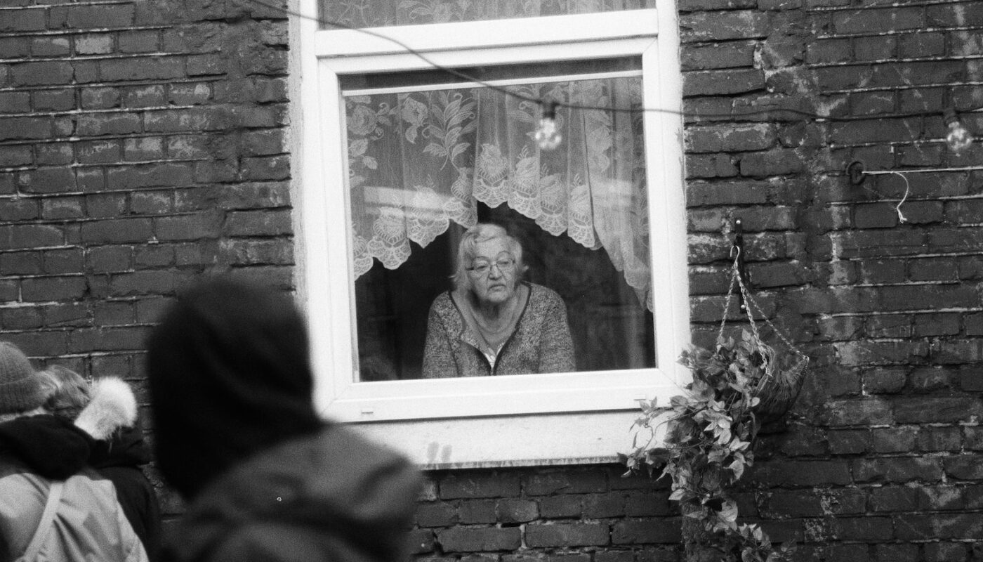 grayscale photo of man and woman in frame