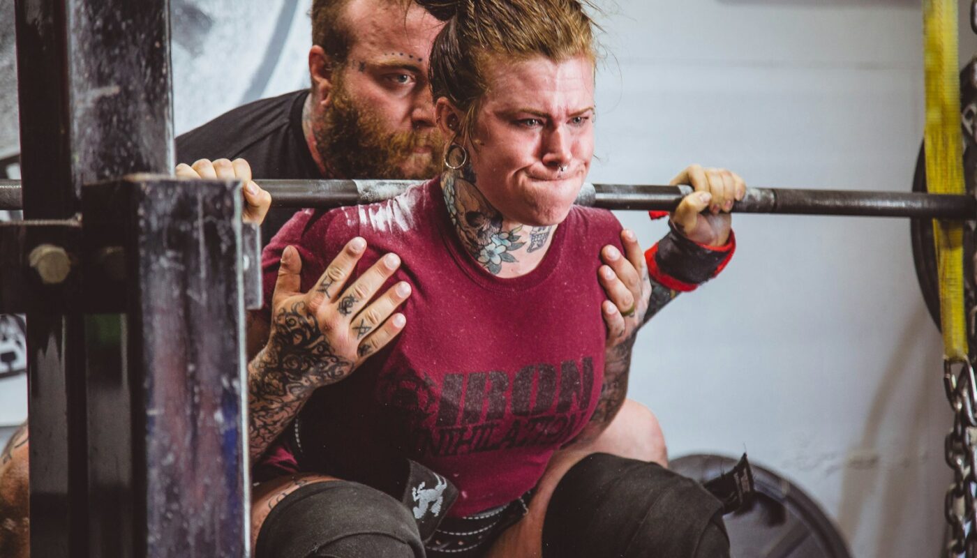 woman carrying barbells
