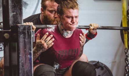 woman carrying barbells